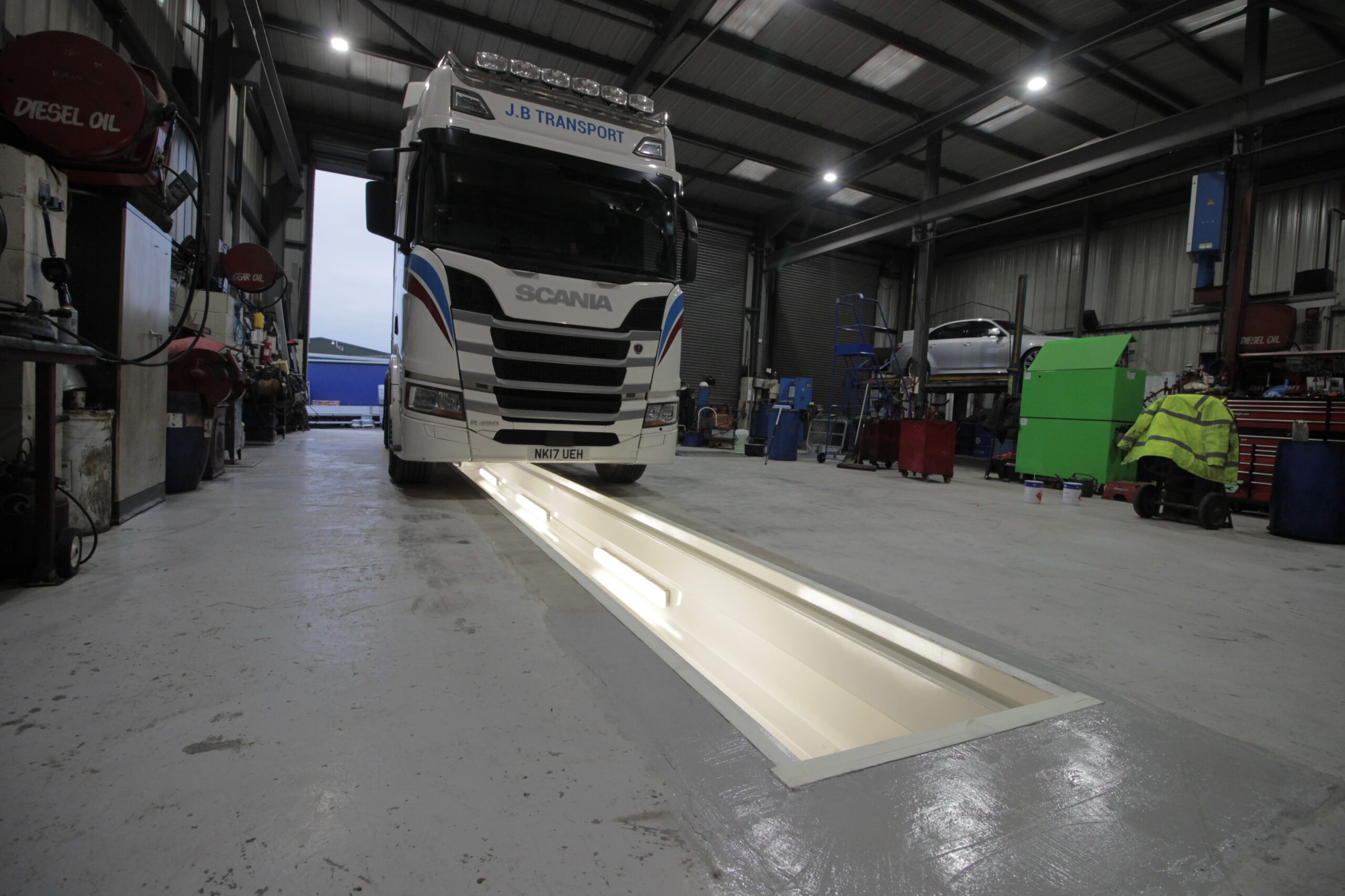 Vehicle over inspection pit