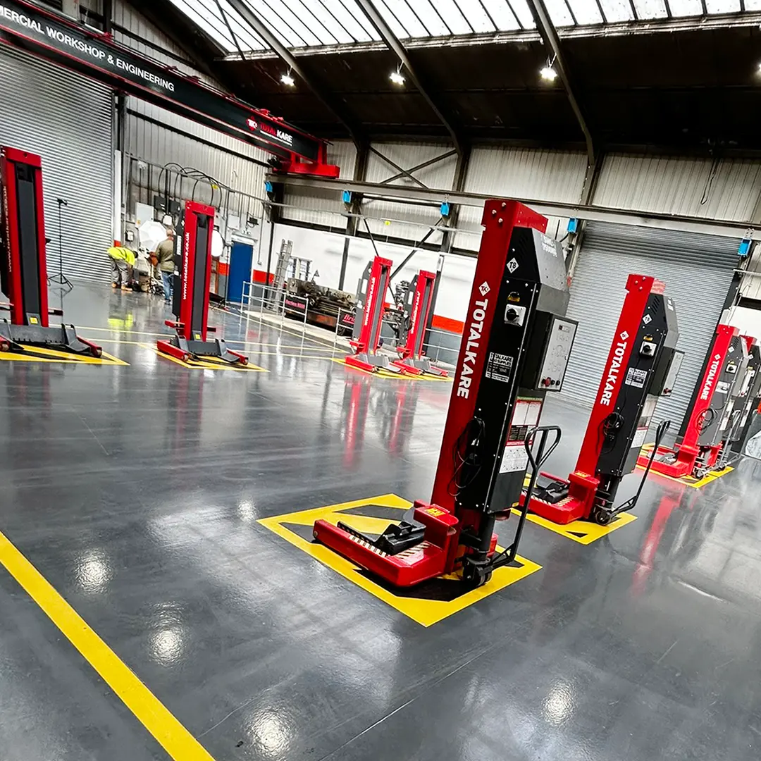 Red Mobile Column Lifts From Totalkare in a Workshop